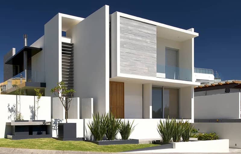 fachada de casa blanca moderna con piedra cantera natural